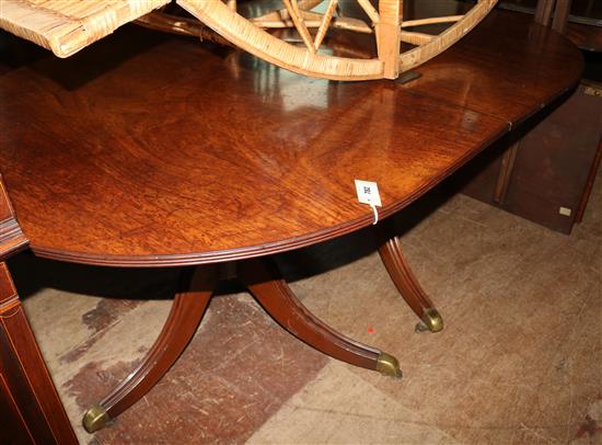 A Regency style mahogany twin pillar dining table, Extends to 9ft 6in. x 3ft 9in.
